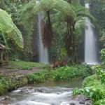 Benang Stokel Waterfall canyon and rocky surroundings.