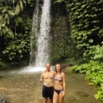 Guests taking photos at Sesere hidden waterfall in Aik Berik village, Lombok