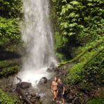 Relaxing at Keliwun hidden waterfall during hiking tour in Lombok
