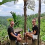 Guests resting at scenic viewpoint during hiking to hidden waterfalls in Aik Berik