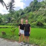 Hiking through rice fields in Aik Berik village during hidden waterfall hike in Lombok