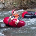 River tubing between rocky cliffs in Babak Valley, Lombok