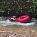 River tubing between rocky cliffs in Babak Valley, Lombok